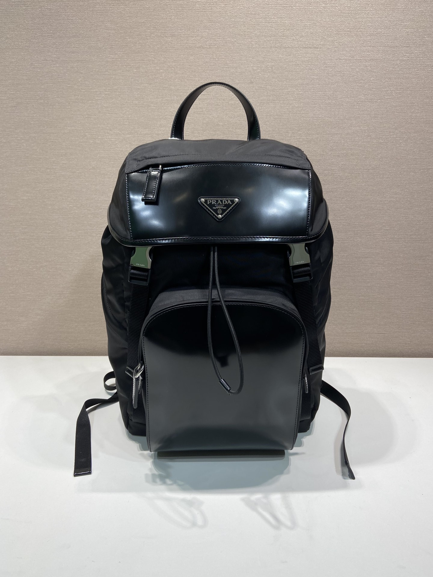 Pra*a re-nylon and brushed leather backpack
